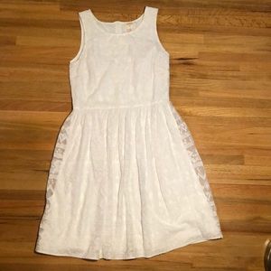 Sundance white dress with lace overlay.